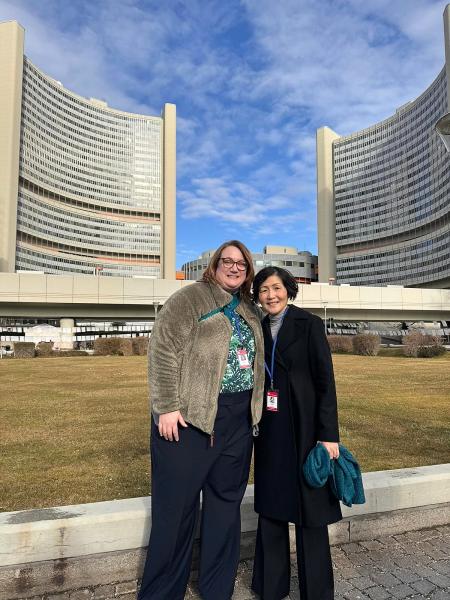megan vinh and chih-ing lim stand in front of the United Nations in Vienna, Austria