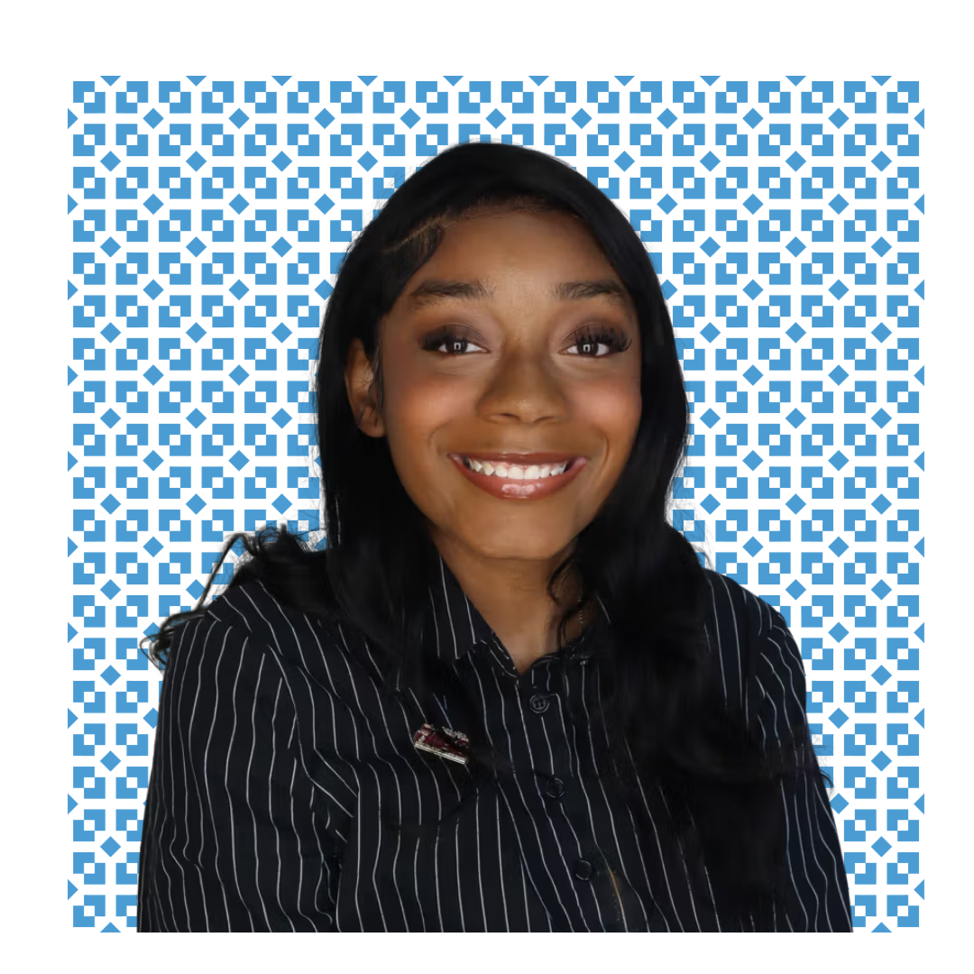 square headshot style photo of karima mitchell-hill with carolina blue design background