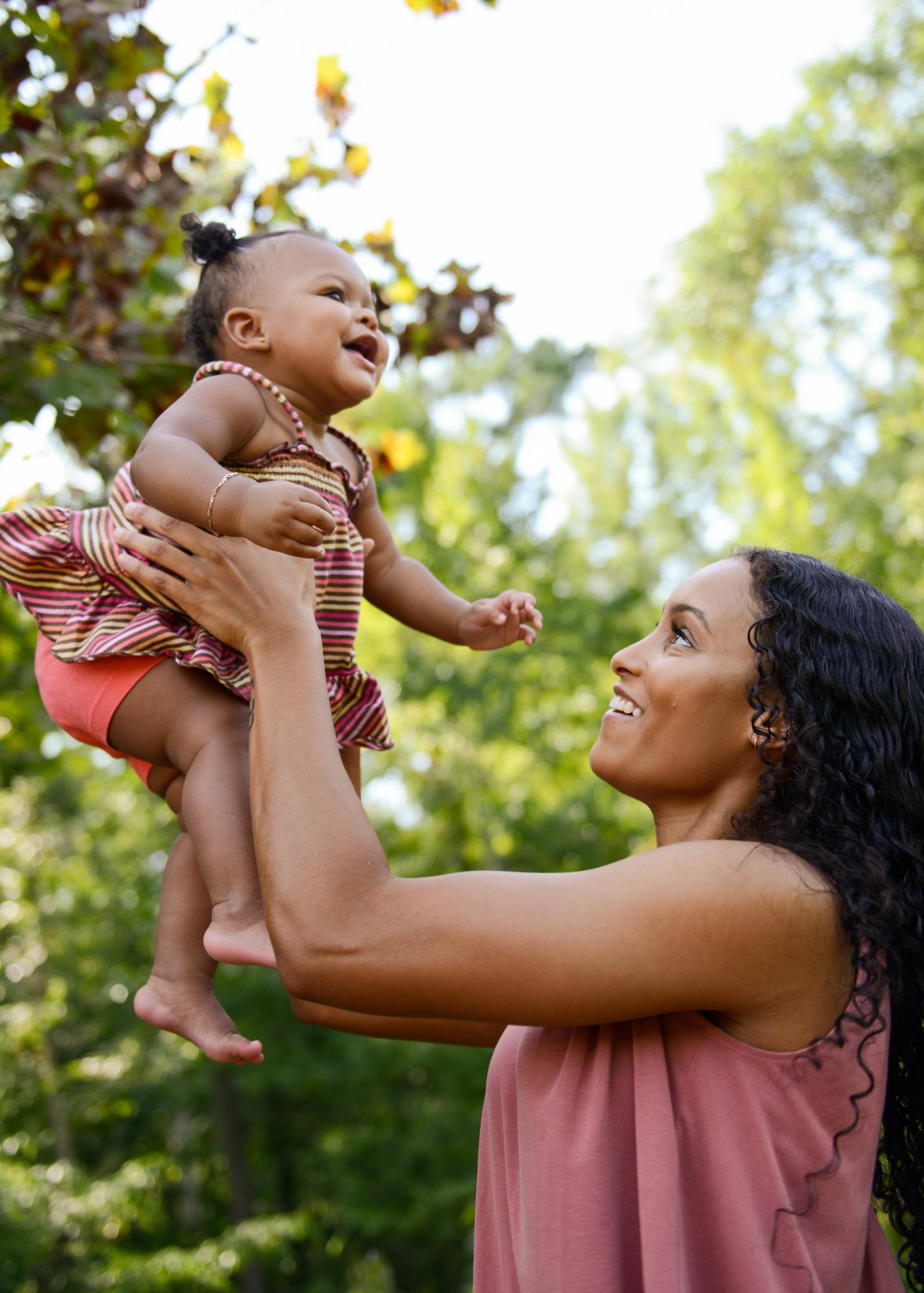 Mother holding an infant in her arms