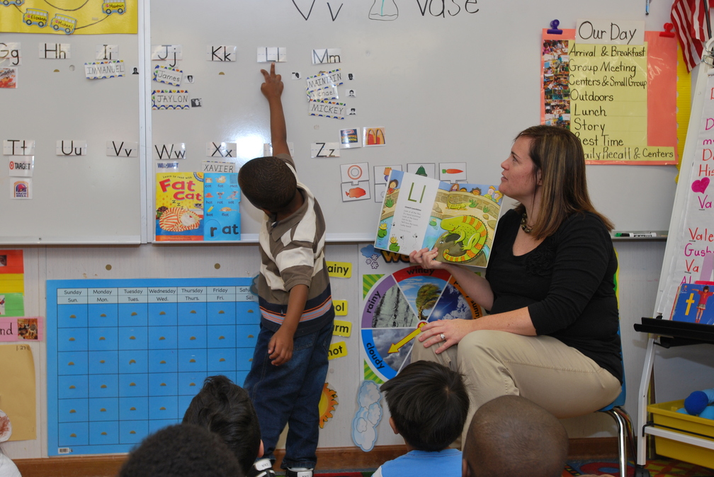 Teacher reading to children