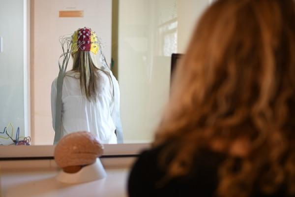 female researcher monitoring female subject in lab
