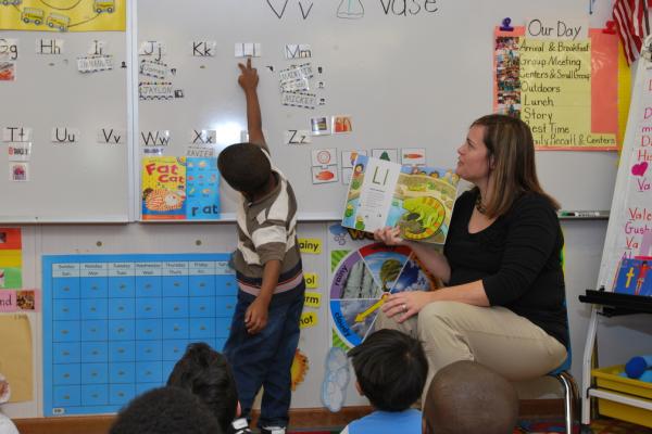 Teacher reading to children