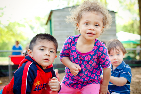 Three young children on a playground