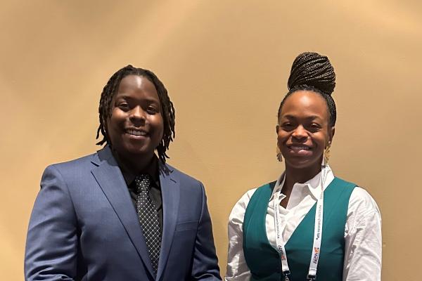 TK Musa (at left) and Danielle Allen (at right) attend AERA annual meeting