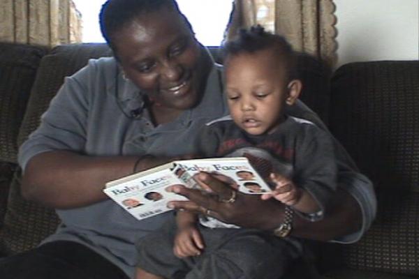 Father reading with young child