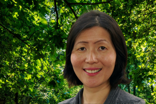 headshot of Chih-Ing Lim standing outside in front of greenery