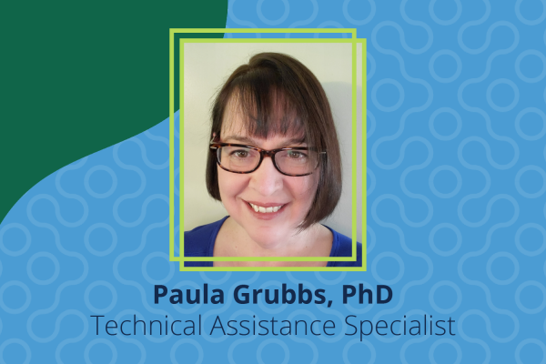 Paula Grubbs headshot with carolina blue background