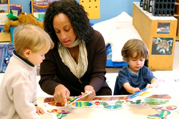 Teacher showing student a puzzle