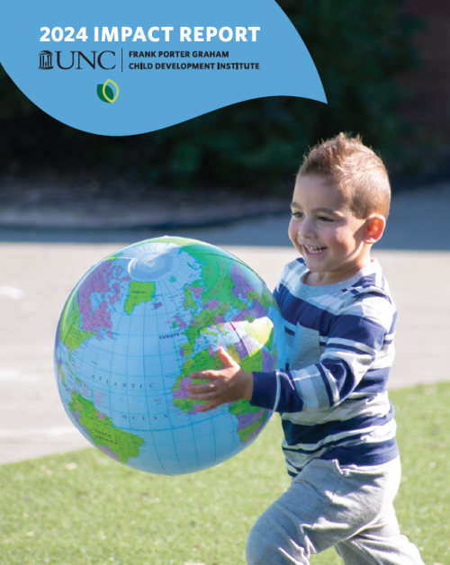 2024 Impact Report UNC Frank Porter Graham Child Development Institute; young boy with dark brown hair and wearing a blue striped shirt carries a blow-up world globe