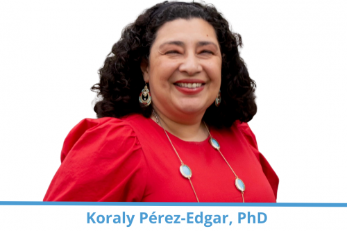 Koraly Pérez-Edgar; woman with dark curly hair and wearing red blouse